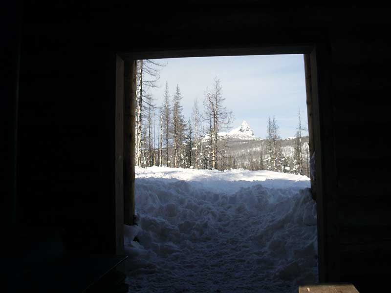 Three Fingered Jack framed by Blowout Shelter door