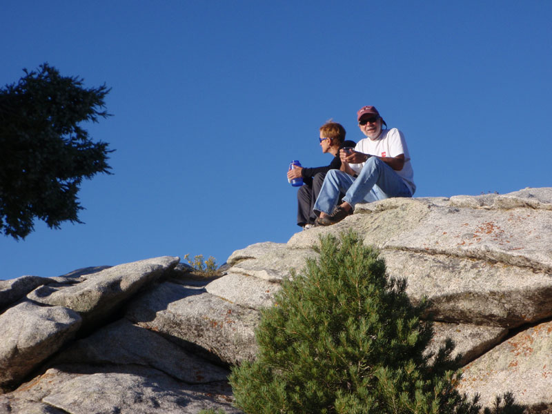 Deb and John on rock at camp