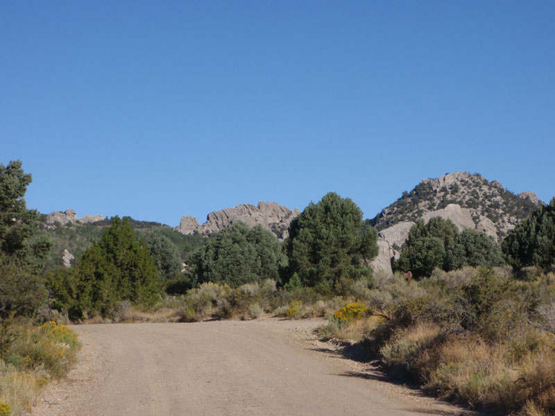 We three hike up the road to Parking Lot Rock