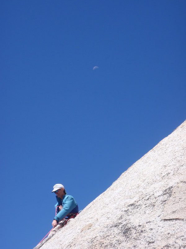 Moon over climber