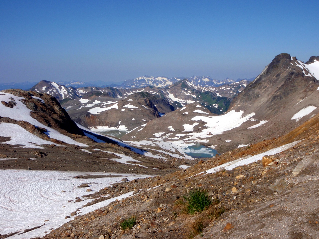 Looking back down at the White Chuck Glacier Basin. White Mountain on the left, Portal Peak right of center