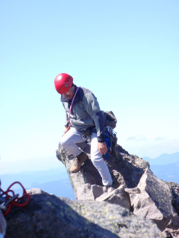 Doug, coming down off the highest rock on the summit