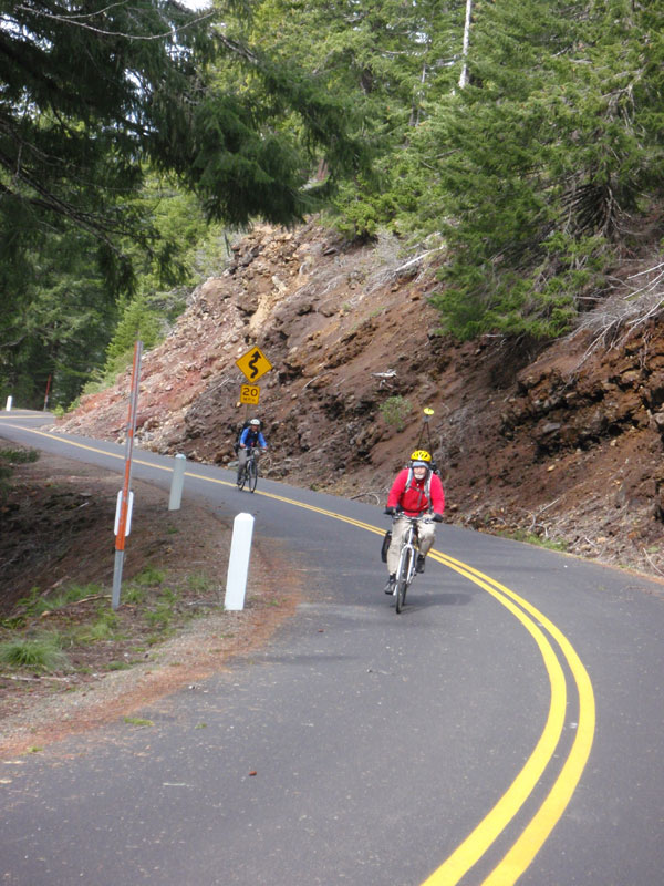 John and Sue, biking up Deadhorse Grade w/ skis &amp; poles