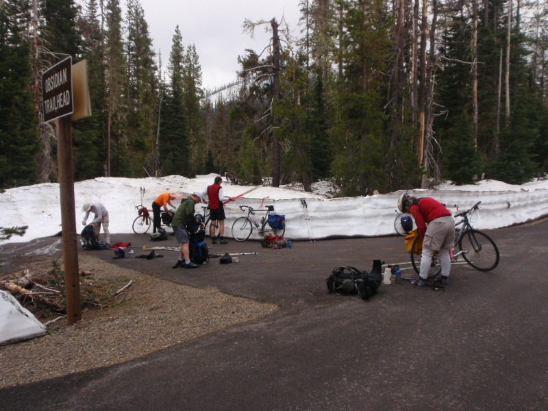 Packing gear back on the bikes for the down-hill run to the upper gate