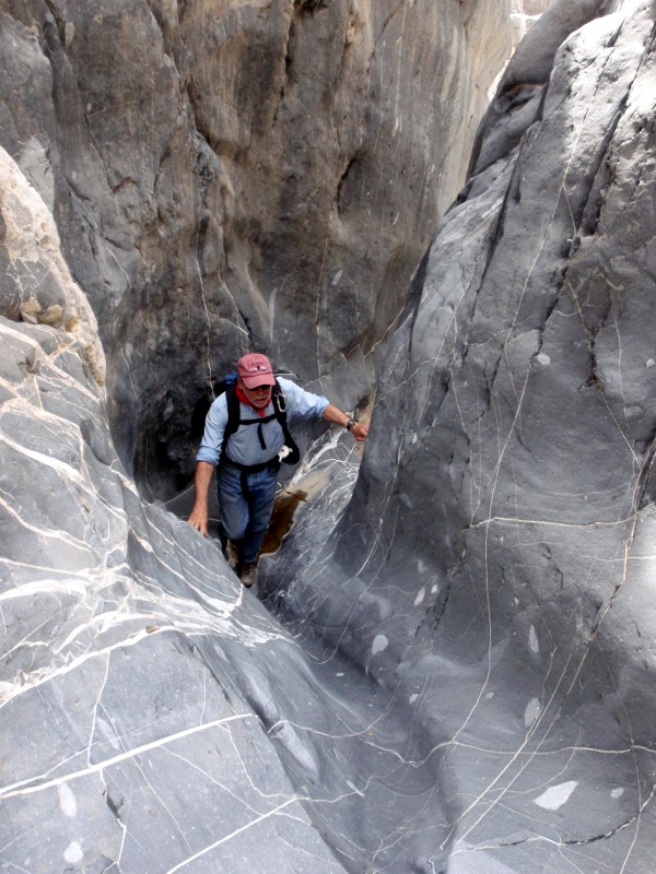 John climbs narrow slot