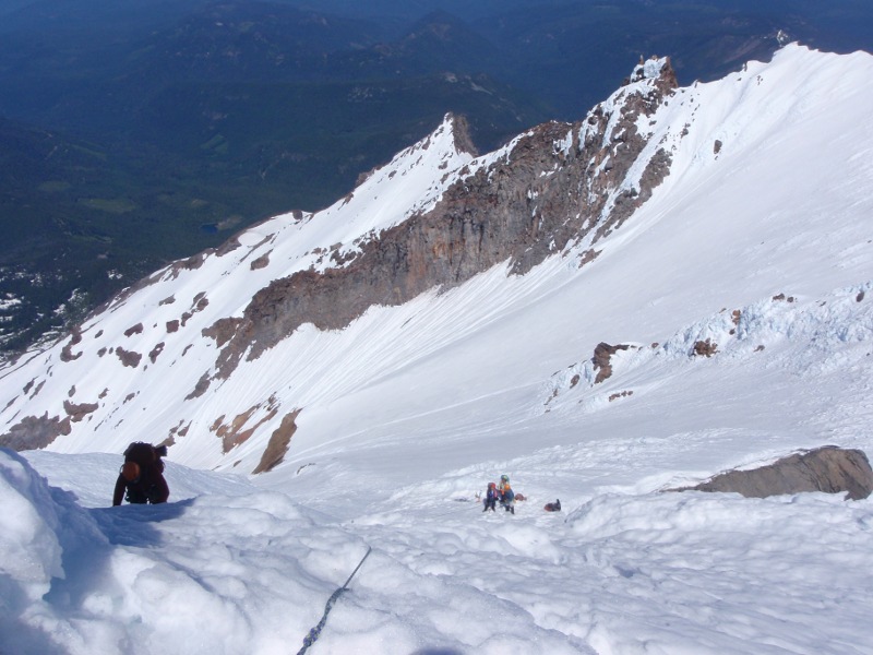 Climbing up to the rock belay